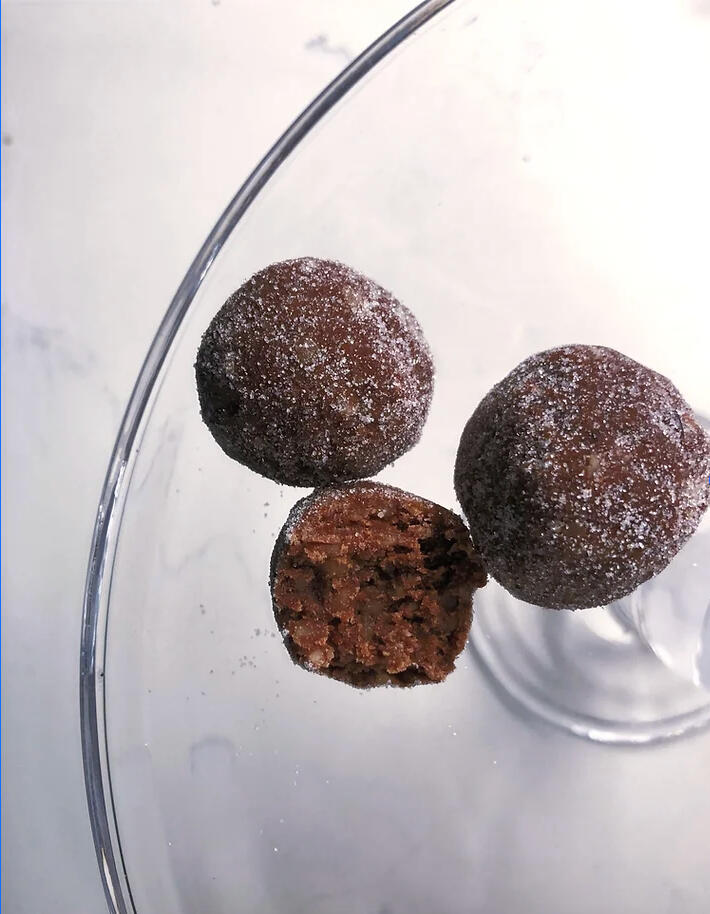 rum ball holiday dessert cookie on glass plate